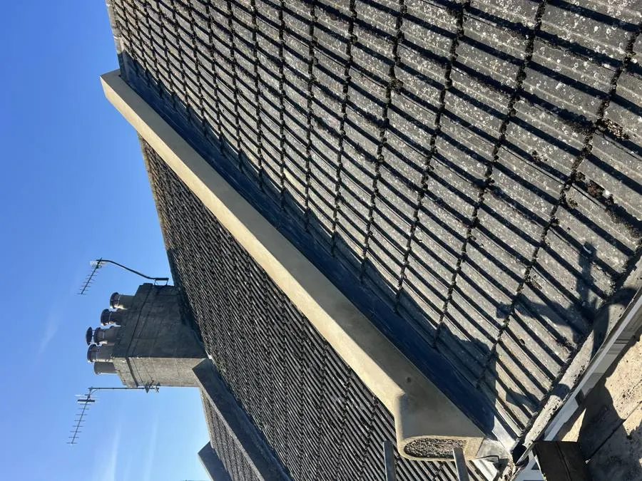 Fire wall after repair, with new render and lead flashing